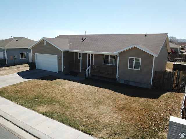 1451 W 925 S, Vernal, UT 84078 - ranch-style home with concrete driveway, fence, a front yard, covered porch, and a garage