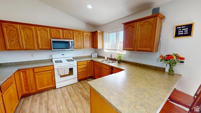 1451 W 925 S, Vernal, UT 84078 - kitchen with white gas range, a peninsula, stainless steel microwave, lofted ceiling, and a sink