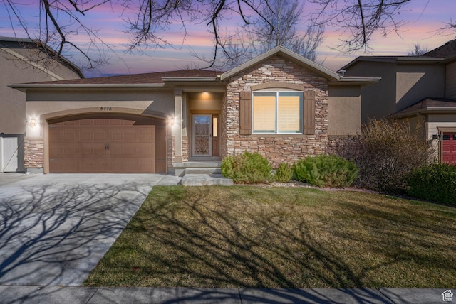 single story home with stone siding, a garage, and stucco siding
