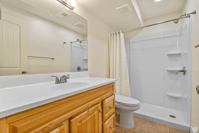 bathroom featuring tile patterned floors, visible vents, and a shower with shower curtain