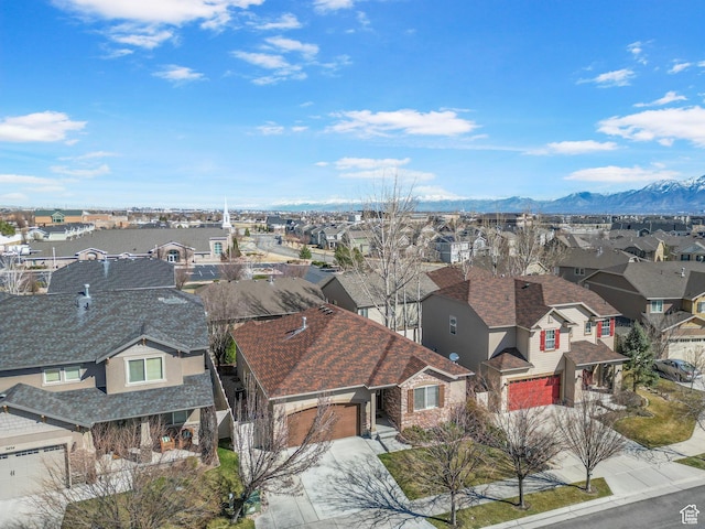 birds eye view of property with a residential view and a mountain view