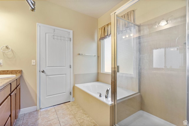 full bathroom with tile patterned floors, vanity, a bath, and a shower stall