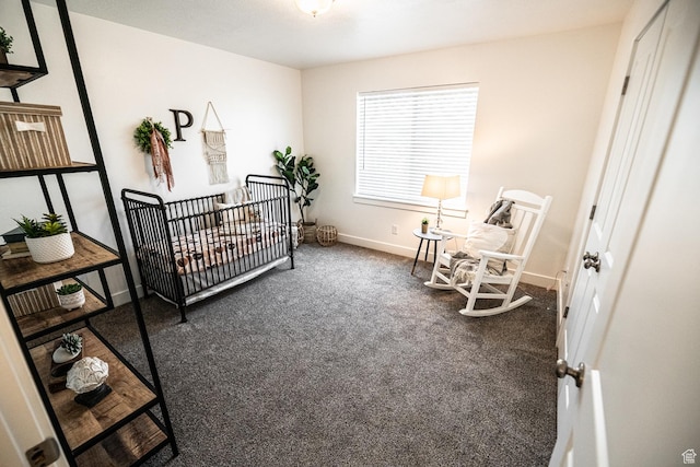 carpeted bedroom featuring baseboards