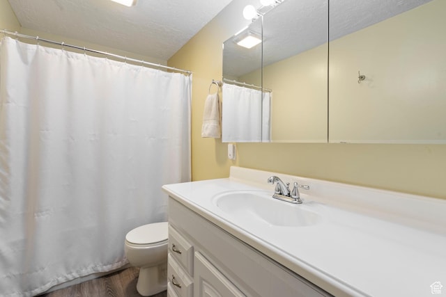 1519 N 2340 W, Clinton, UT 84015 - full bathroom featuring toilet, vanity, a shower with curtain, wood finished floors, and a textured ceiling