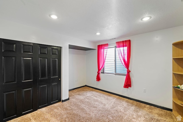 1519 N 2340 W, Clinton, UT 84015 - unfurnished bedroom with baseboards, carpet floors, a textured ceiling, and recessed lighting