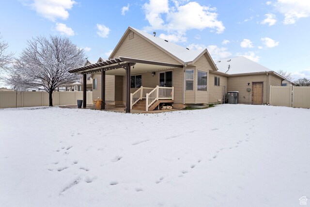 1519 N 2340 W, Clinton, UT 84015 - snow covered back of property featuring a pergola and fence