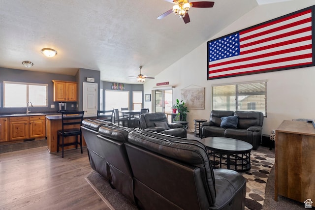 1519 N 2340 W, Clinton, UT 84015 - living area with a ceiling fan, plenty of natural light, and wood finished floors