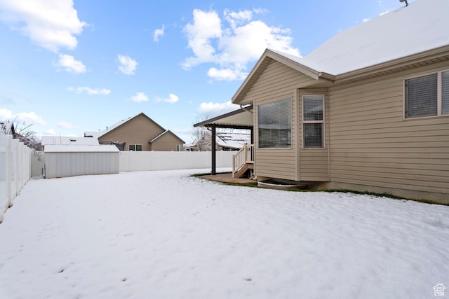 1519 N 2340 W, Clinton, UT 84015 - snowy yard featuring a fenced backyard