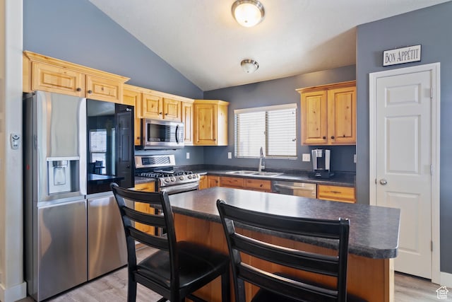 1519 N 2340 W, Clinton, UT 84015 - kitchen featuring vaulted ceiling, a sink, a center island, stainless steel appliances, and dark countertops