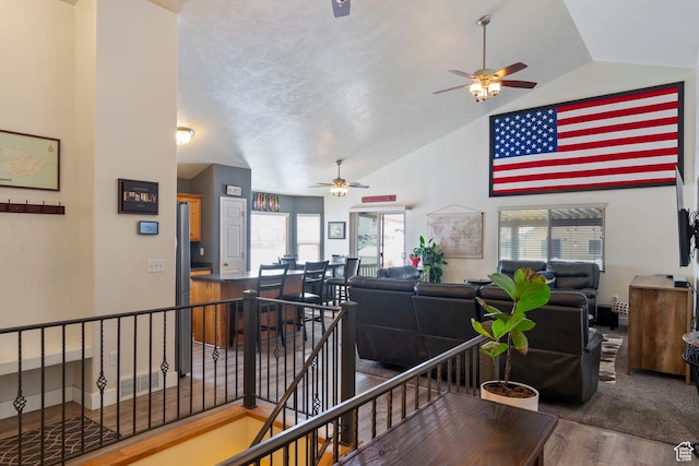 1519 N 2340 W, Clinton, UT 84015 - interior space with high vaulted ceiling, an upstairs landing, wood finished floors, a textured ceiling, and visible vents