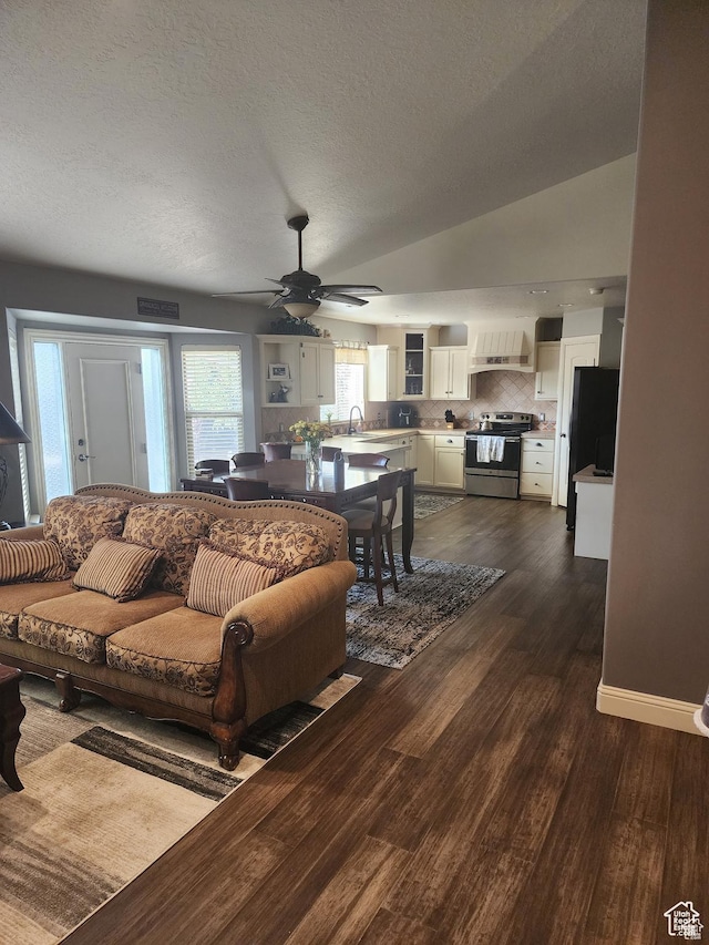 4263 W 11475 S, South Jordan, UT 84095 - living room with a textured ceiling, lofted ceiling, visible vents, ceiling fan, and dark wood-type flooring