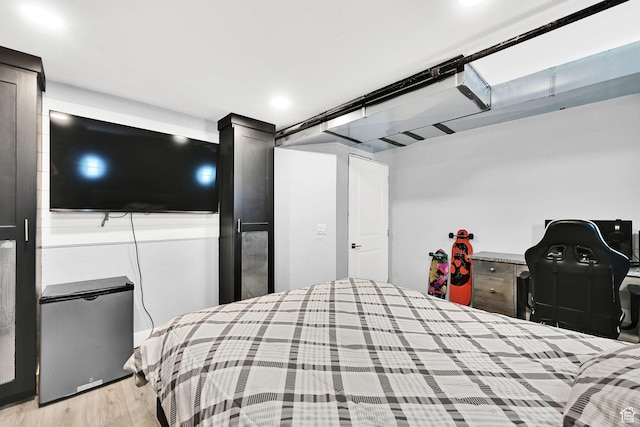 2466 W 3375 S, West Haven, UT 84401 - bedroom featuring light wood-style flooring and fridge