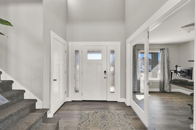 2466 W 3375 S, West Haven, UT 84401 - entrance foyer featuring stairway, french doors, baseboards, a high ceiling, and wood finished floors