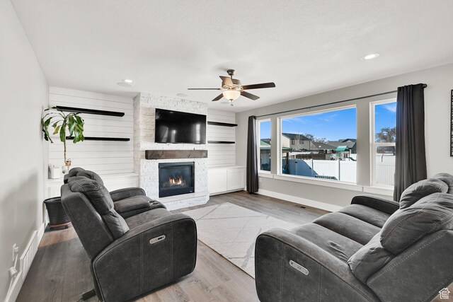 2466 W 3375 S, West Haven, UT 84401 - living area featuring a fireplace, wood finished floors, baseboards, ceiling fan, and recessed lighting