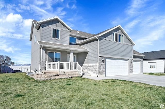 2466 W 3375 S, West Haven, UT 84401 - view of front of property with driveway, covered porch, stone siding, board and batten siding, and a front lawn