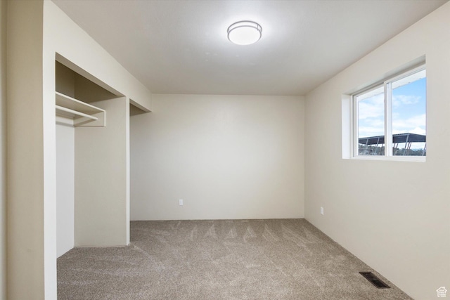 interior space featuring carpet flooring and visible vents