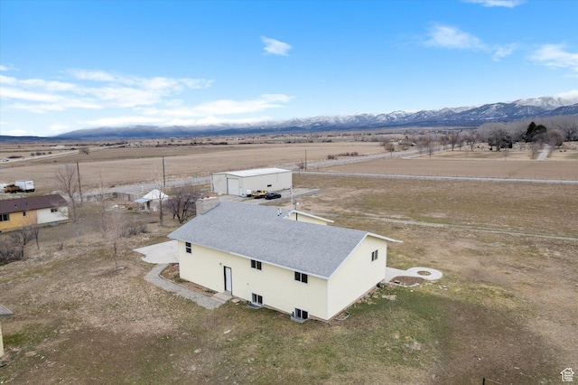 birds eye view of property featuring a rural view and a mountain view