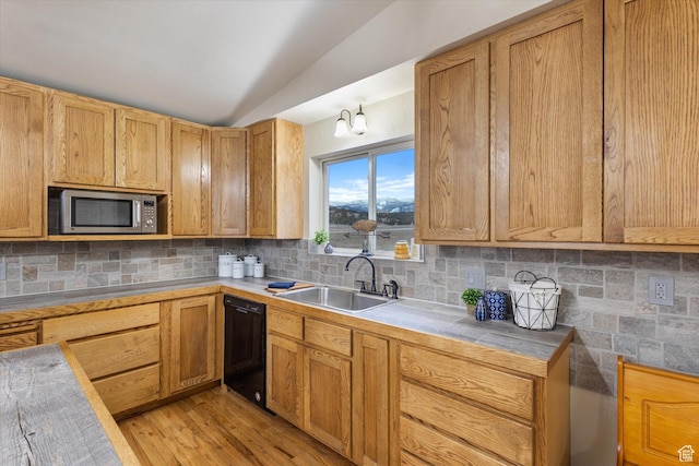 kitchen with lofted ceiling, stainless steel microwave, backsplash, a sink, and dishwasher