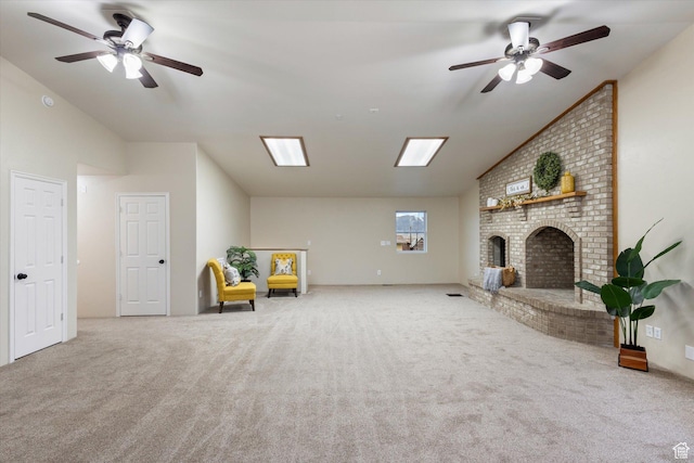 unfurnished room featuring carpet, vaulted ceiling, and ceiling fan