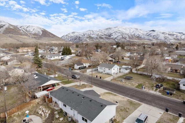 birds eye view of property with a mountain view and a residential view