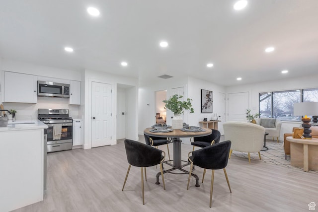 4165 W 4715 S, Kearns, UT 84118 - dining space with light wood-type flooring, recessed lighting, and visible vents