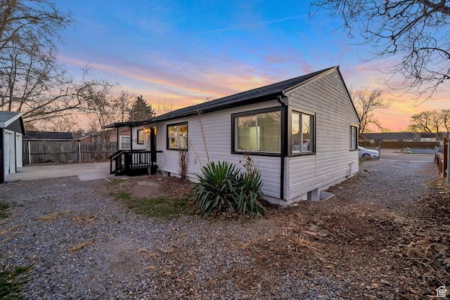 view of home's exterior featuring fence