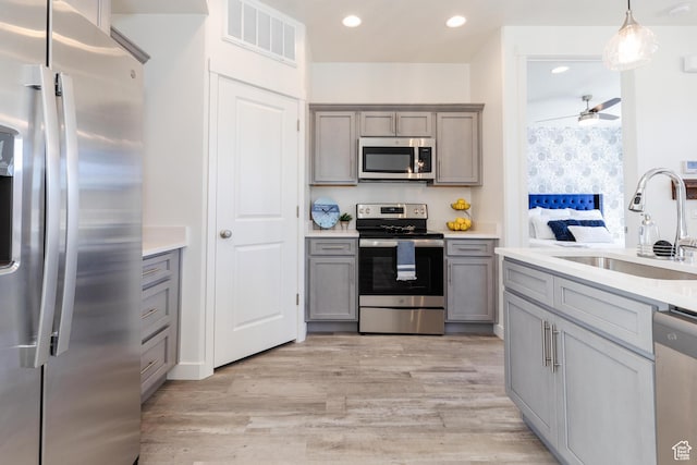 526 N Richland Valley St Unit 10, Garden City, UT 84028 - kitchen with gray cabinetry, visible vents, and appliances with stainless steel finishes