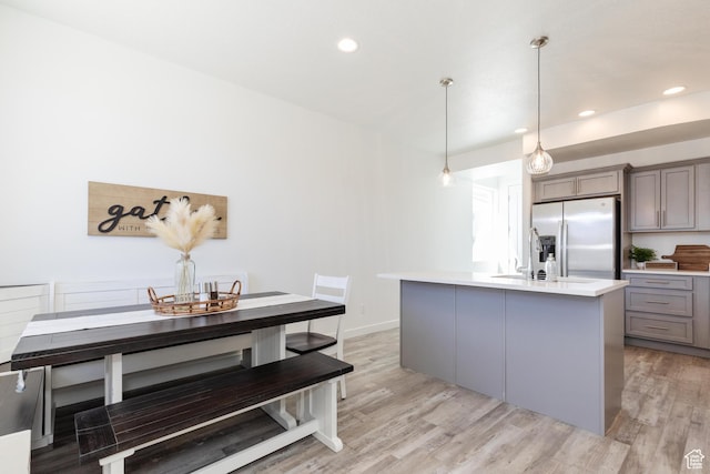 526 N Richland Valley St Unit 10, Garden City, UT 84028 - kitchen featuring light countertops, stainless steel refrigerator with ice dispenser, recessed lighting, gray cabinets, and light wood finished floors