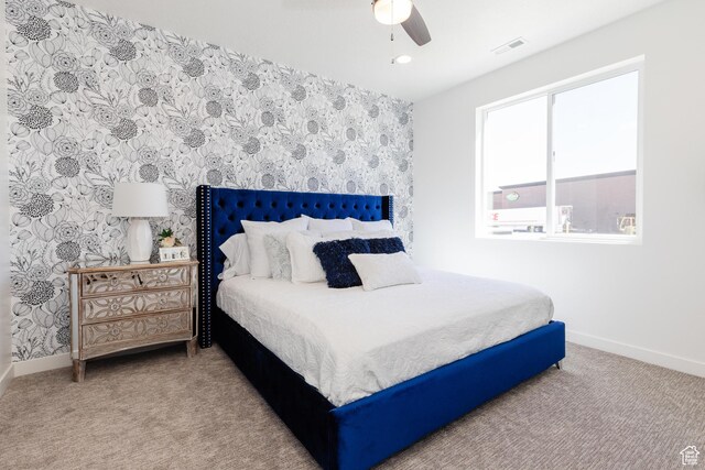 526 N Richland Valley St Unit 10, Garden City, UT 84028 - carpeted bedroom featuring baseboards, visible vents, wallpapered walls, and a ceiling fan