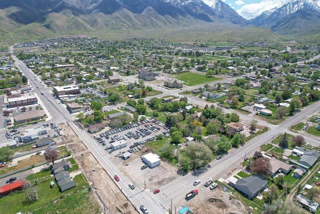 aerial view of property and surrounding area with a mountain backdrop