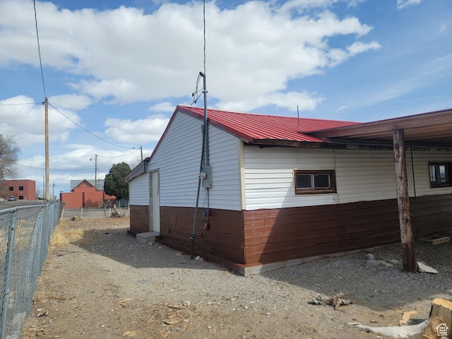 250 8th St, Wendover, UT 84083 - view of side of home with metal roof and fence