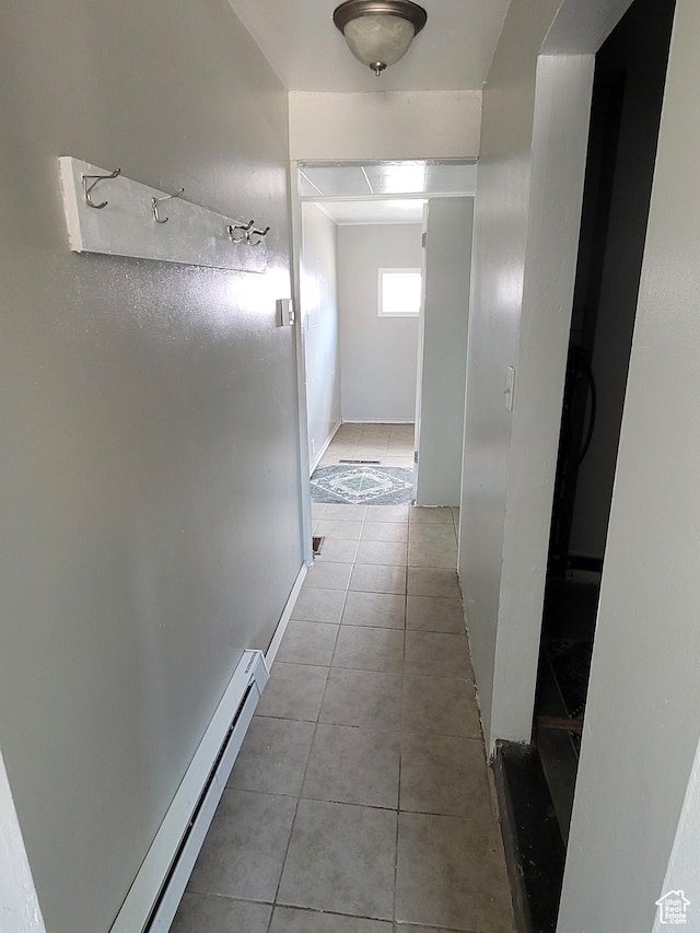 250 8th St, Wendover, UT 84083 - corridor featuring baseboards, baseboard heating, and tile patterned flooring