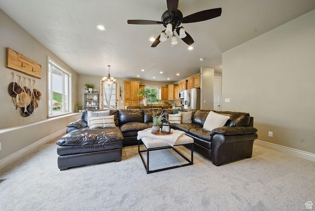 1637 E 2400 N, Layton, UT 84040 - living room with ceiling fan with notable chandelier, baseboards, and light colored carpet