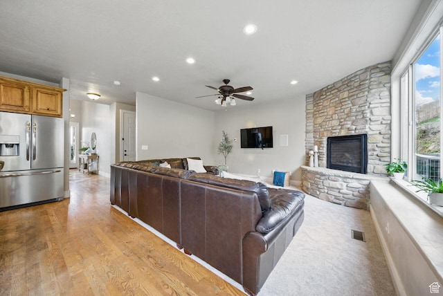 1637 E 2400 N, Layton, UT 84040 - living area with light wood finished floors, a fireplace, visible vents, ceiling fan, and recessed lighting
