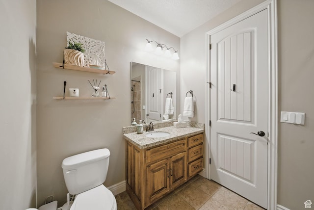 1637 E 2400 N, Layton, UT 84040 - bathroom with toilet, vanity, and baseboards