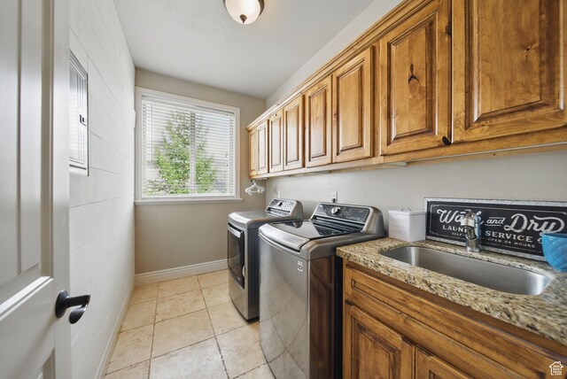 1637 E 2400 N, Layton, UT 84040 - washroom with a sink, washing machine and clothes dryer, light tile patterned floors, baseboards, and cabinet space