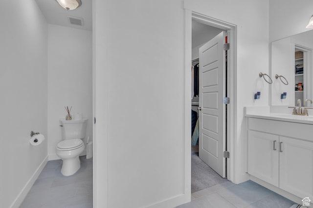 3457 W Blue Crane Dr N, Clinton, UT 84015 - bathroom with vanity, toilet, tile patterned flooring, and baseboards