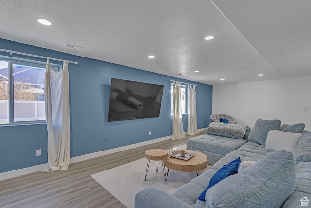 3457 W Blue Crane Dr N, Clinton, UT 84015 - living area featuring a textured ceiling, baseboards, recessed lighting, and wood finished floors
