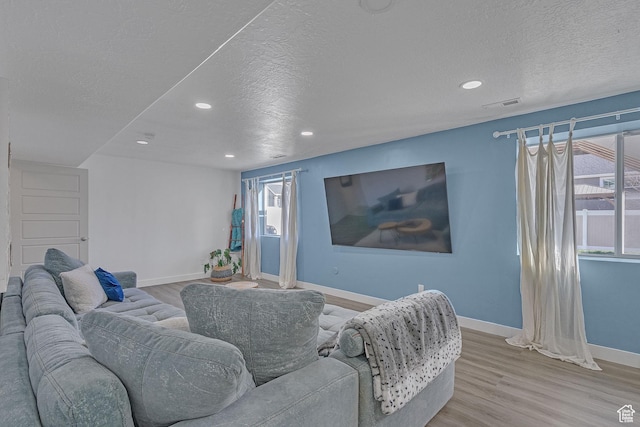 3457 W Blue Crane Dr N, Clinton, UT 84015 - living area with baseboards, a textured ceiling, wood finished floors, recessed lighting, and healthy amount of natural light