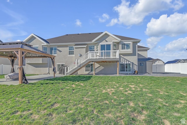 3457 W Blue Crane Dr N, Clinton, UT 84015 - rear view of property with stairs, stucco siding, a gazebo, and a patio area