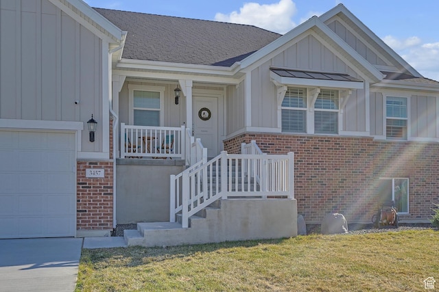 3457 W Blue Crane Dr N, Clinton, UT 84015 - property entrance with board and batten siding, brick siding, a lawn, a porch, and roof with shingles
