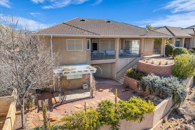799 N 2600 W, Hurricane, UT 84737 - rear view of property featuring a tiled roof, stucco siding, stairs, and a patio area