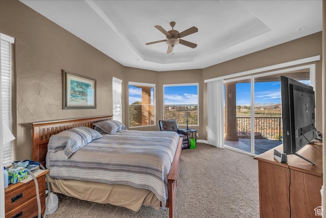 799 N 2600 W, Hurricane, UT 84737 - bedroom featuring carpet, baseboards, access to outside, a ceiling fan, and a tray ceiling