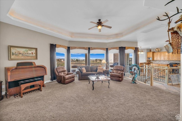 799 N 2600 W, Hurricane, UT 84737 - carpeted living room with baseboards, ceiling fan, and a raised ceiling