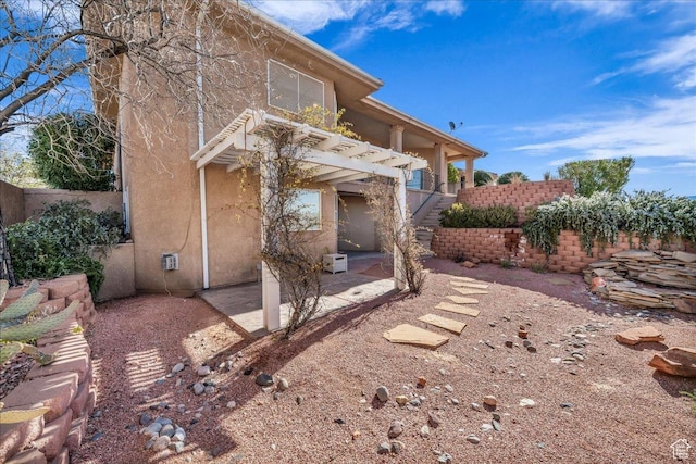 799 N 2600 W, Hurricane, UT 84737 - exterior space with stucco siding, fence, stairs, a patio, and a pergola