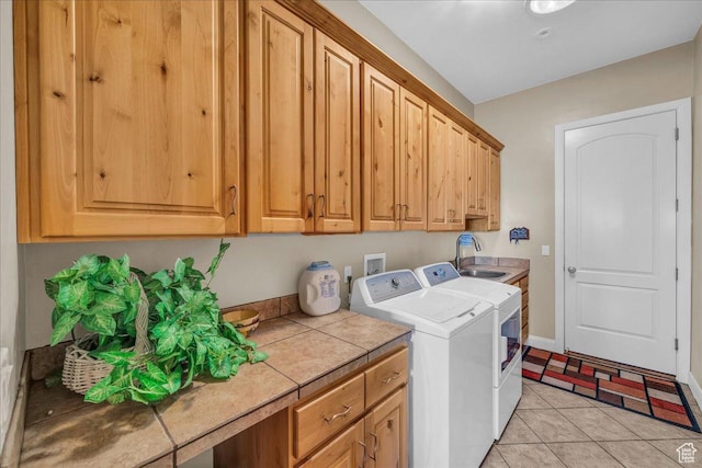 799 N 2600 W, Hurricane, UT 84737 - clothes washing area with light tile patterned floors, baseboards, a sink, cabinet space, and washing machine and dryer