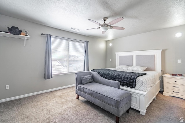 1301 W Indian Hills Dr Unit 59, St George, UT 84770 - bedroom with baseboards, carpet floors, ceiling fan, and visible vents