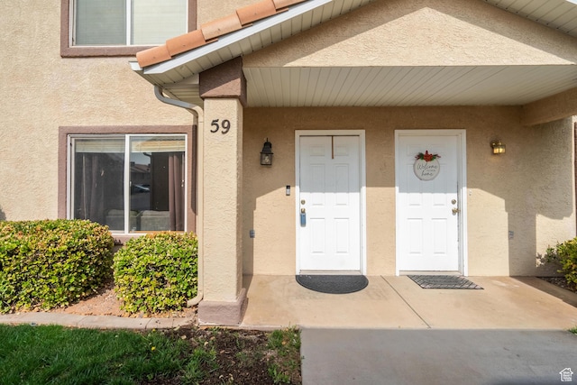 1301 W Indian Hills Dr Unit 59, St George, UT 84770 - doorway to property with stucco siding