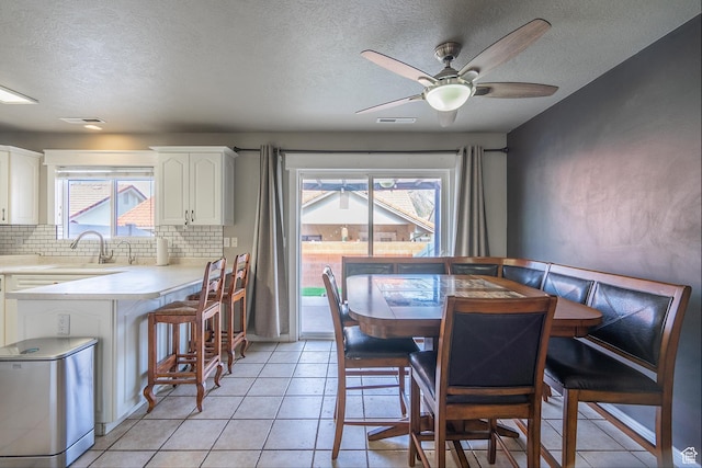 1301 W Indian Hills Dr Unit 59, St George, UT 84770 - dining area featuring a ceiling fan, light tile patterned floors, and visible vents