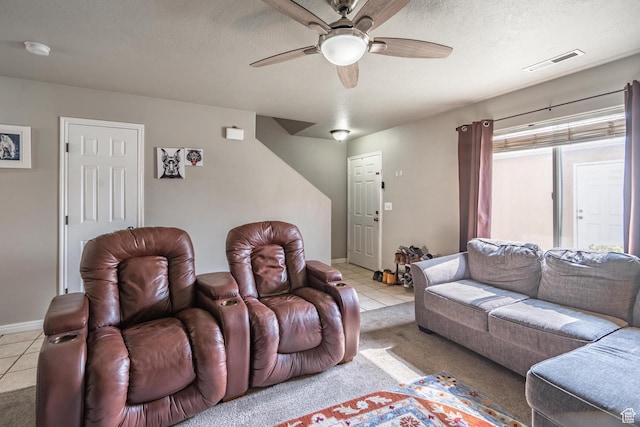 1301 W Indian Hills Dr Unit 59, St George, UT 84770 - living room featuring light tile patterned floors, a textured ceiling, visible vents, and a ceiling fan